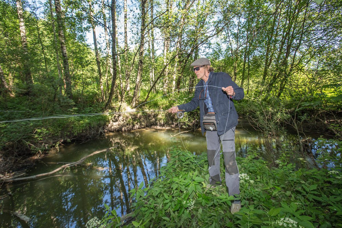 man fishing in the Alna river