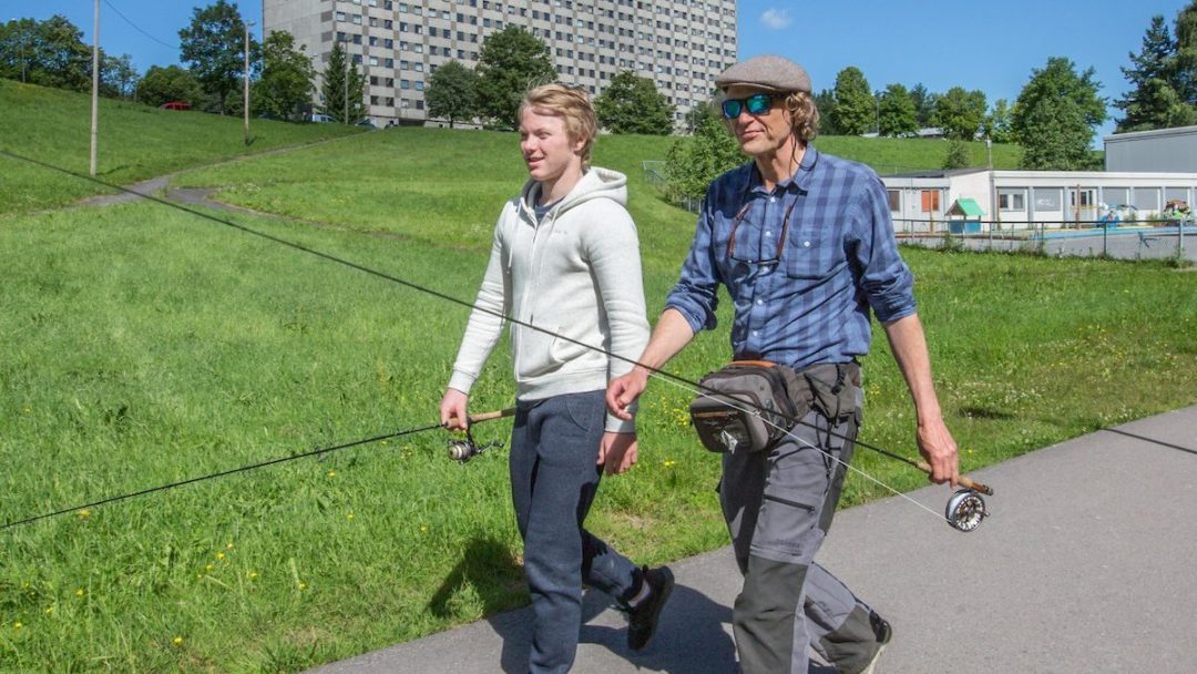 two men with fishing rods