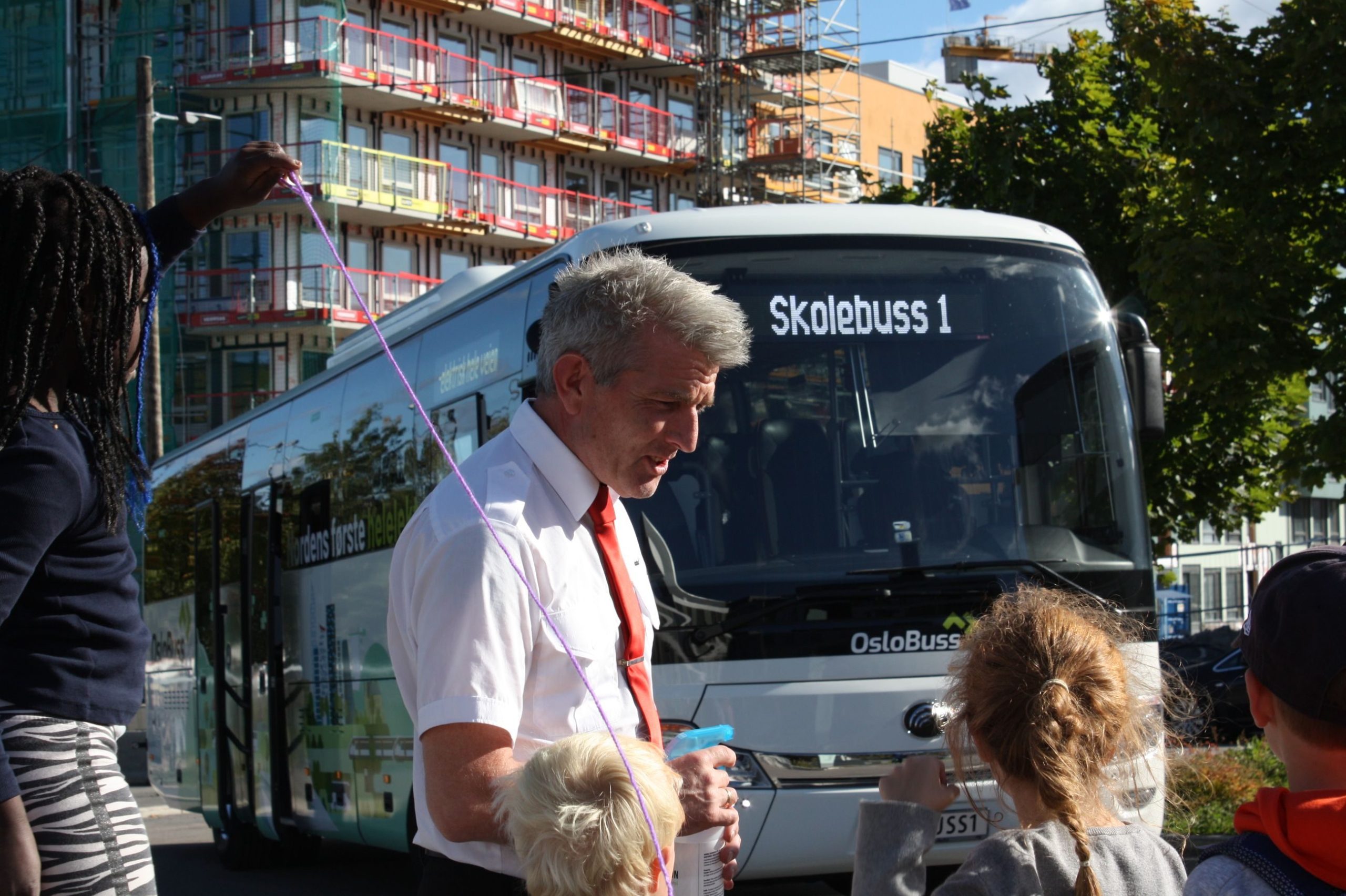 man and child outside bus