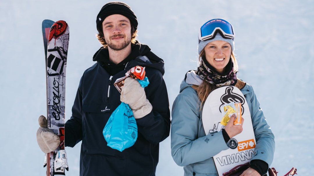 en mann og en dame i vintersportsklær, slalomski og snowboard