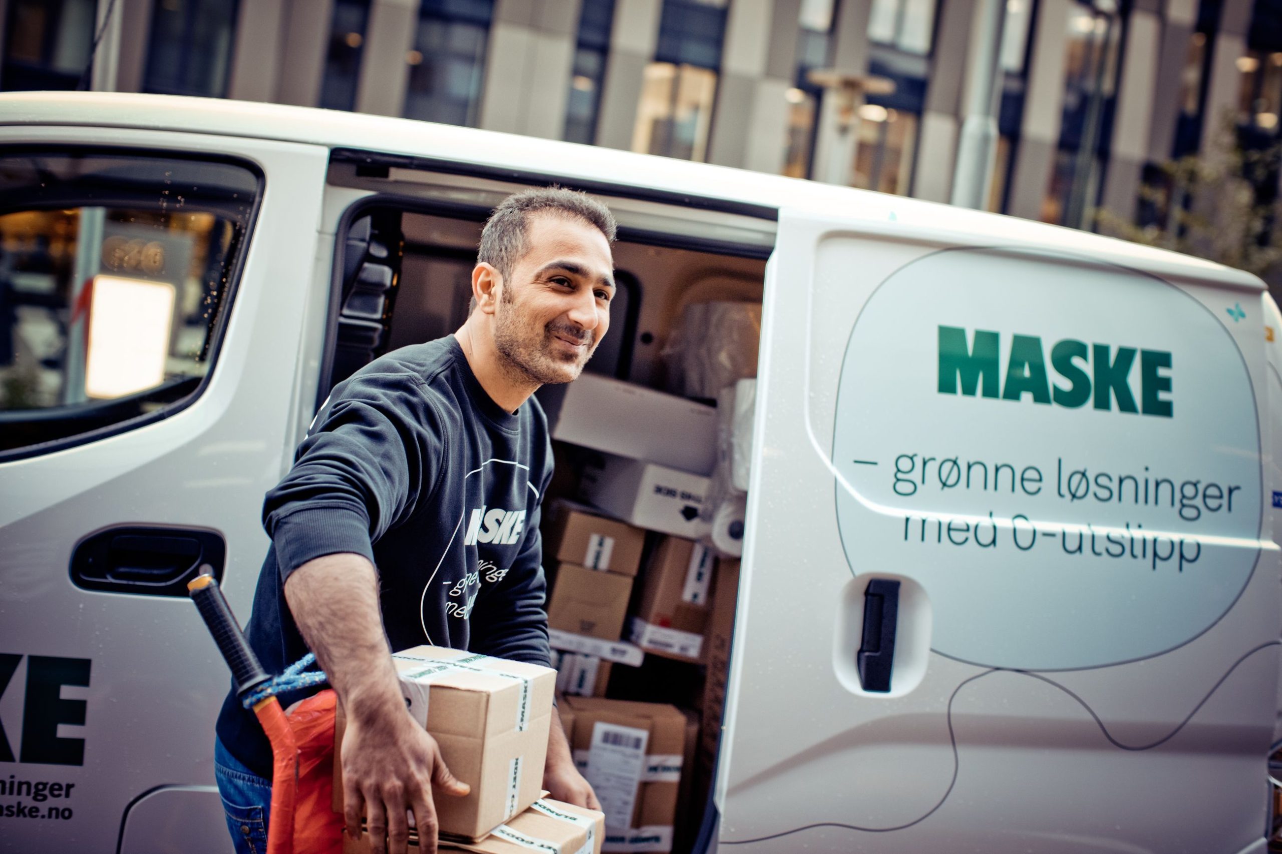 man loading electric van