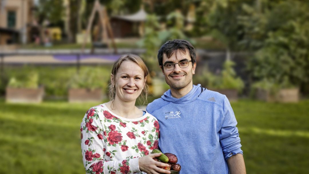 Ginta Šolyté and Hadrien Copponnex with plantcontainer in public open space in the background