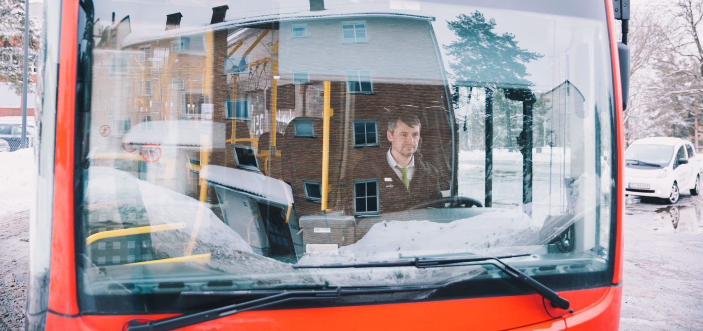 man driving an electric bus