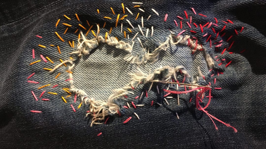 reperasjon av et stykke tøy